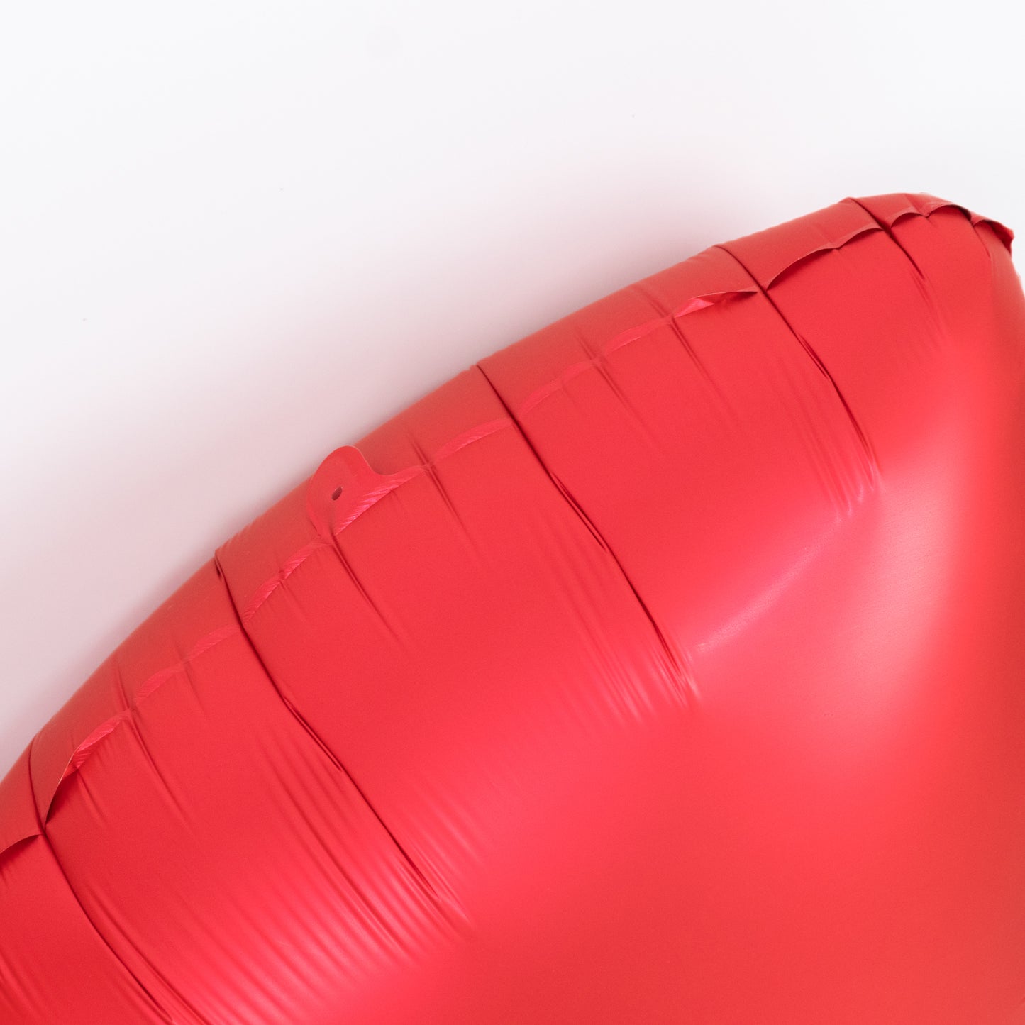 Matte red giant decorative foil bow balloon for party styling.