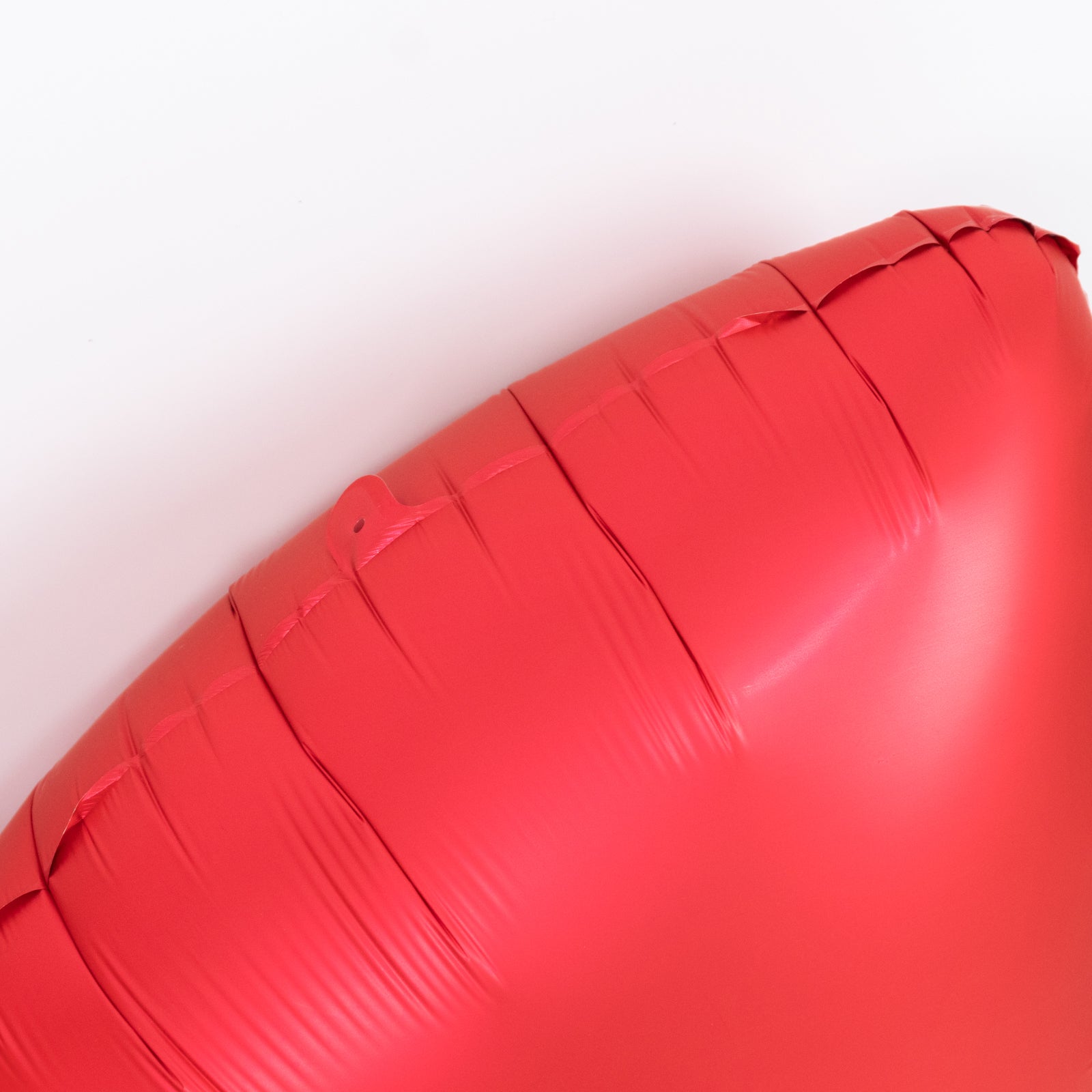 Matte red giant decorative foil bow balloon for party styling.