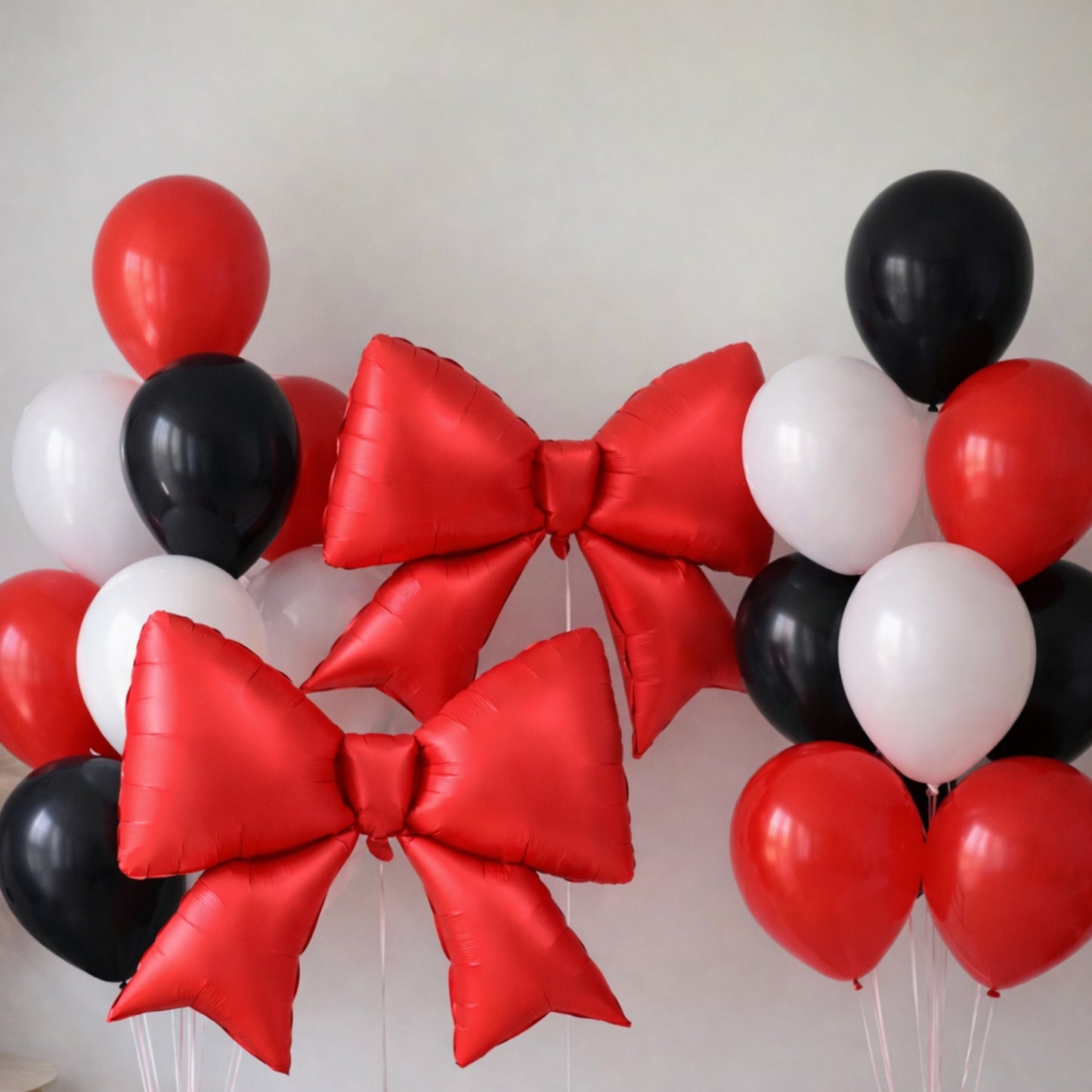 Matte red giant decorative foil bow balloons for party decoration.