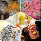 Assorted metallic gold long latex balloons for party decorations and animal modeling.