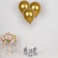 Metallic silver foil tassel balloon weights with gold balloons.