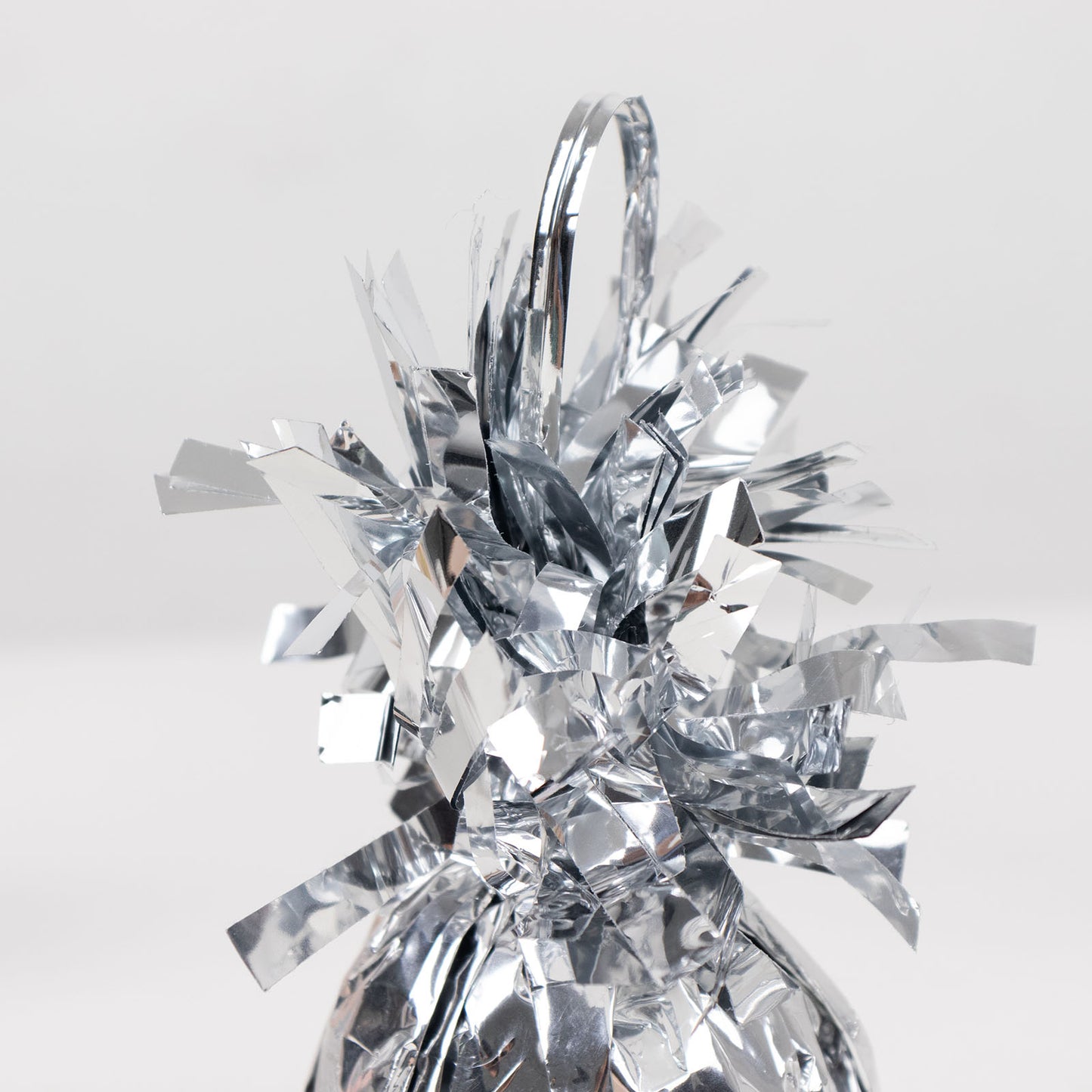 Metallic silver foil tassel balloon weight, 5.5oz, perfect for party decorations.