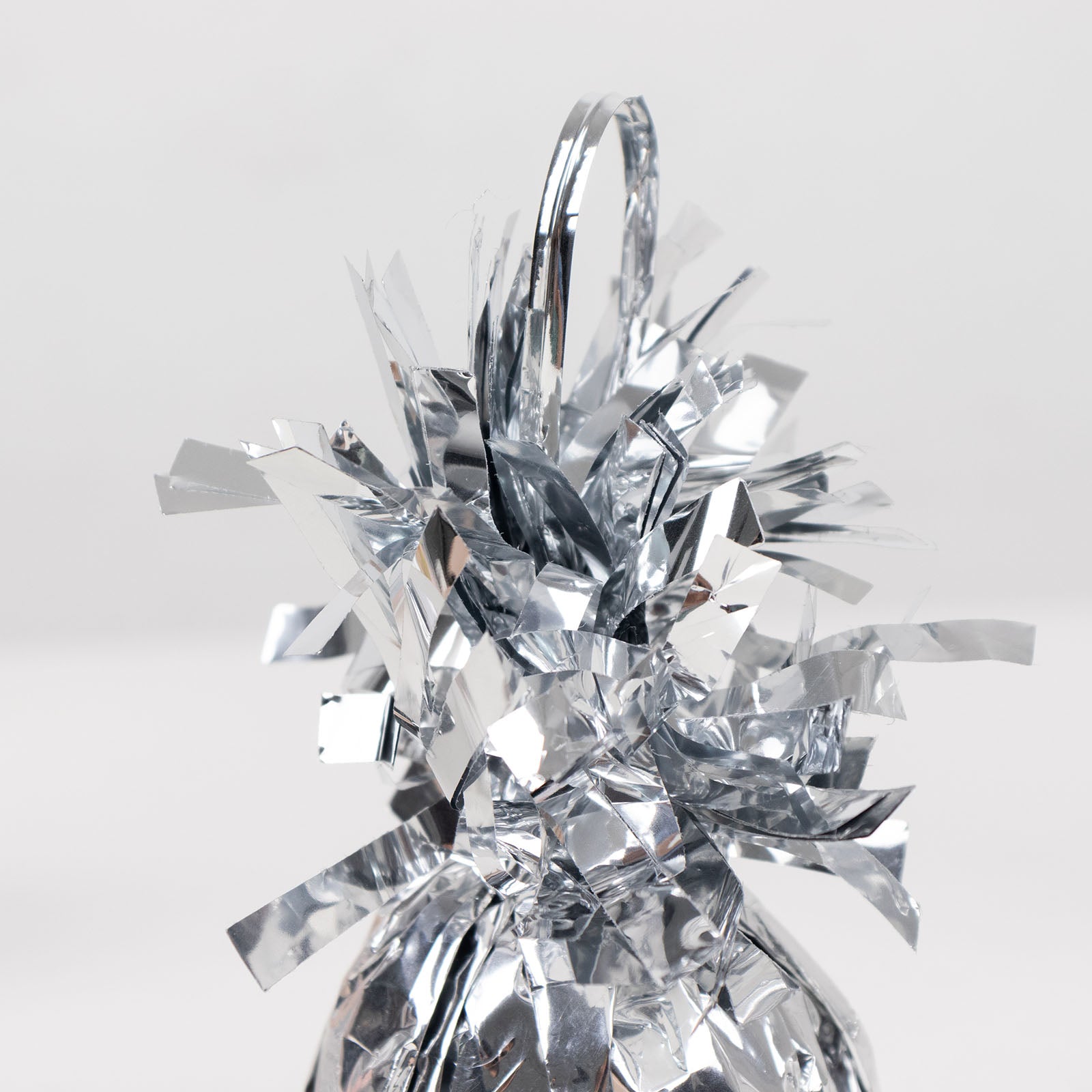 Metallic silver foil tassel balloon weight, 5.5oz, perfect for party decorations.