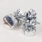 Metallic silver foil tassel top party balloon weights, 5.5oz, 12 pack.