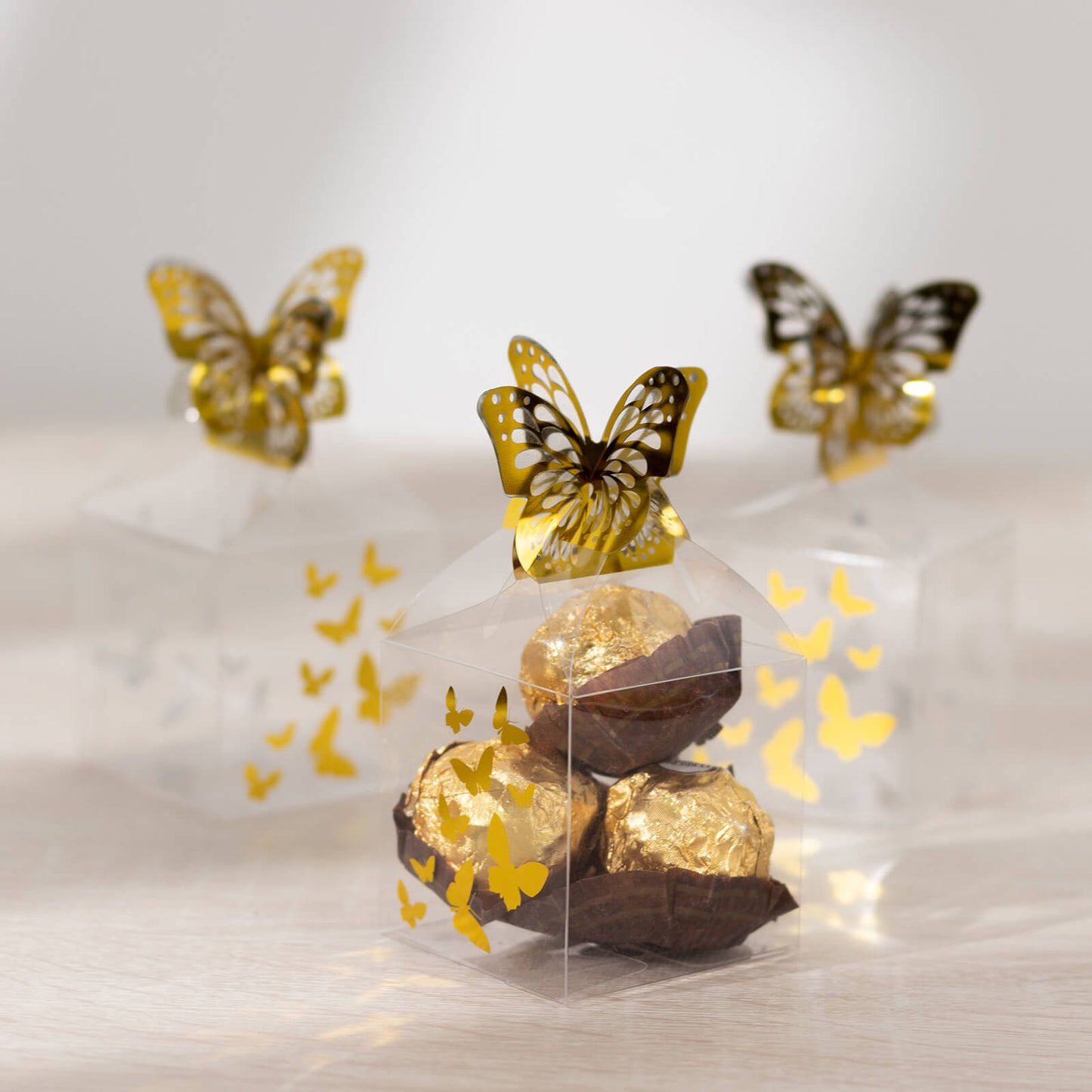 25 Pack Clear Transparent Square Party Favor Boxes with Gold Butterfly Top, Clear Candy Treat Gift Boxes - 2"x2"x4"