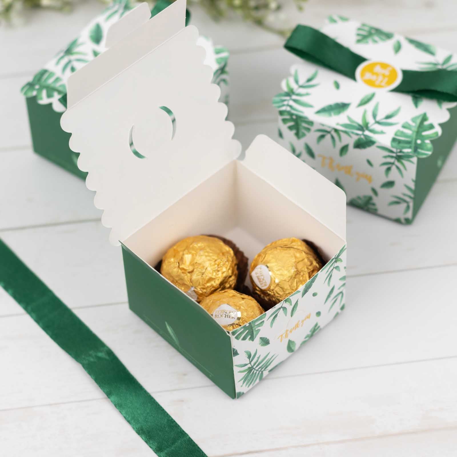 Green monstera leaf print candy gift boxes with satin ribbon and thank you card.