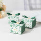 Green monstera leaf print candy gift boxes with ribbon and thank you card.