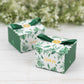 Green monstera leaf print candy gift boxes with satin ribbon bows.