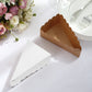 Natural brown paper cake boxes with white base, triangular shape, scalloped top.