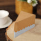 Natural brown paper cake box with white base, triangular shape for desserts.