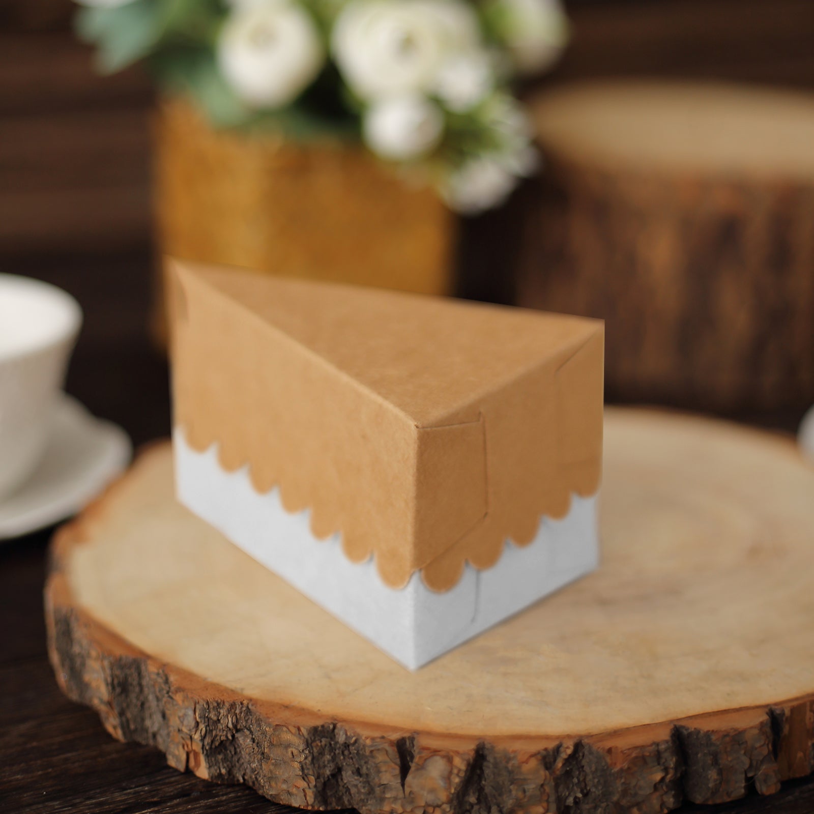 Natural brown paper triangular pie slice dessert box with scalloped top.