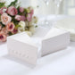 White triangular pie slice dessert boxes with scalloped tops.