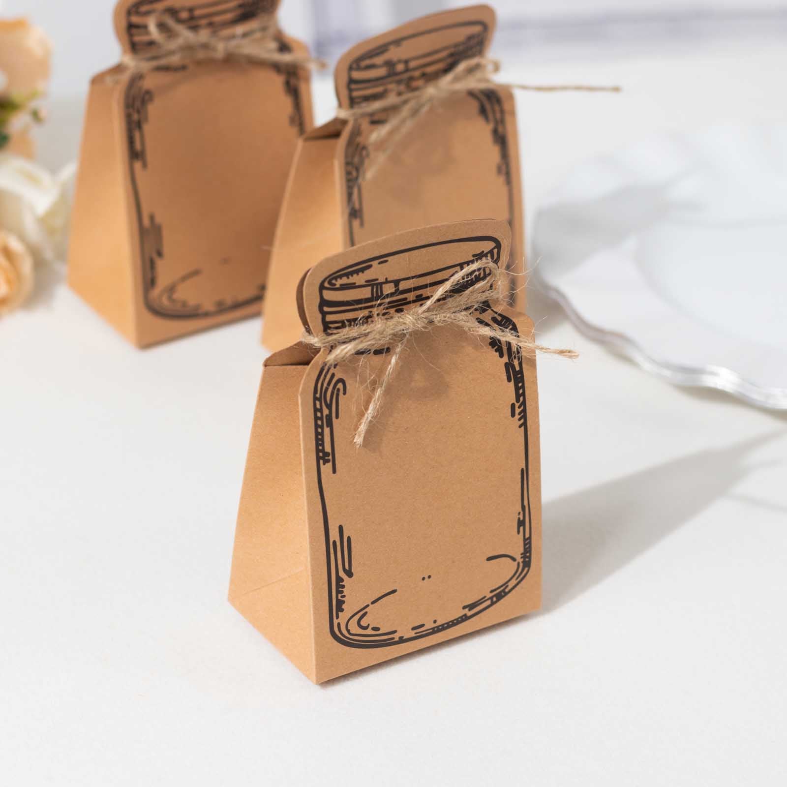 Natural mini mason jar shaped paper party favor boxes in brown with jute rope ties.