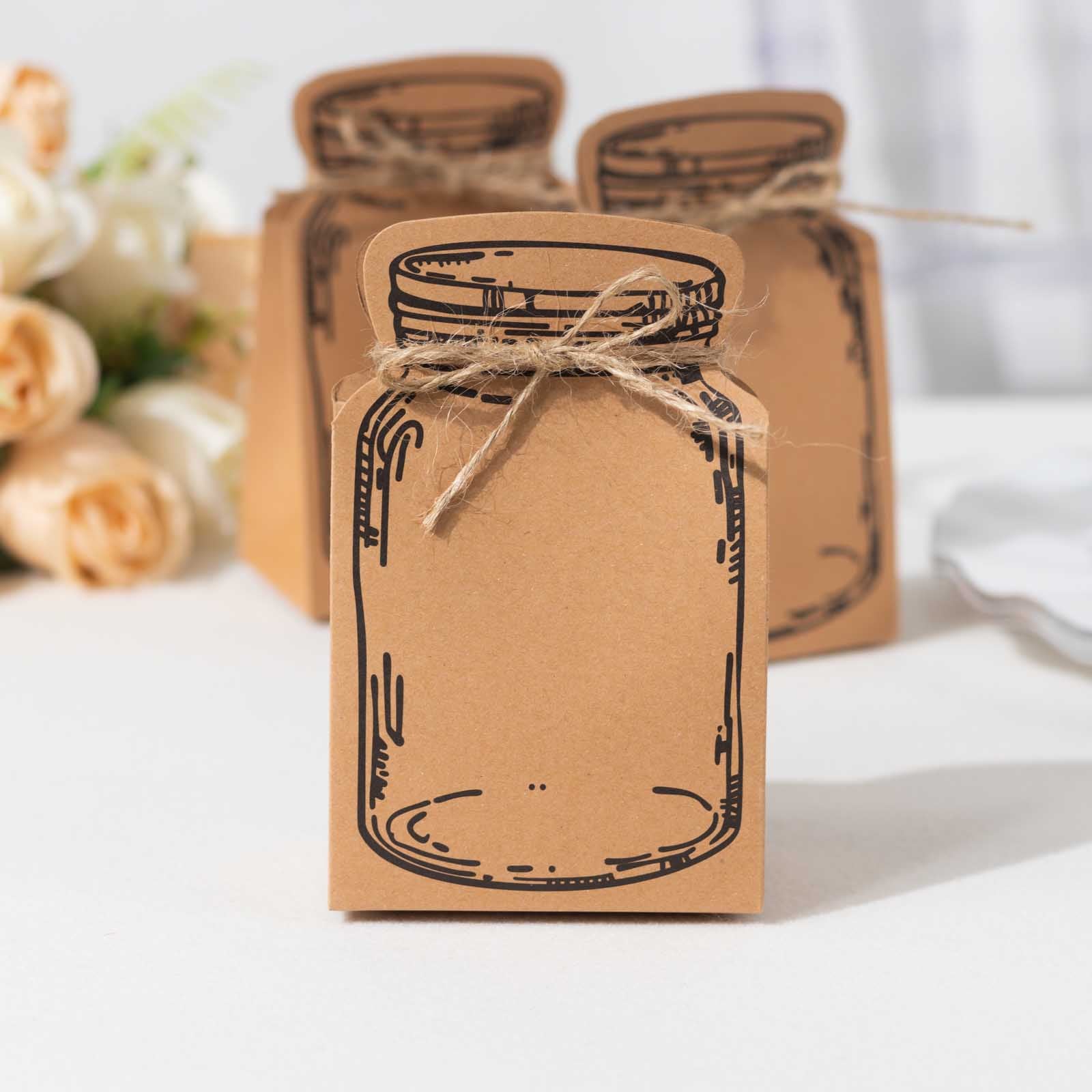 Natural paper mason jar shaped party favor boxes with jute rope ties.