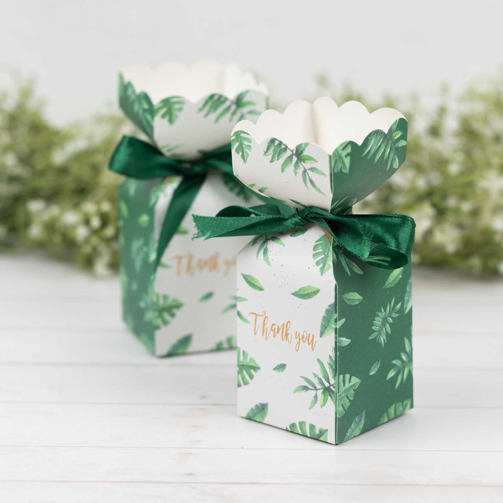Green leaf print satin ribbon candy gift boxes with floral tops. #whtbkgd