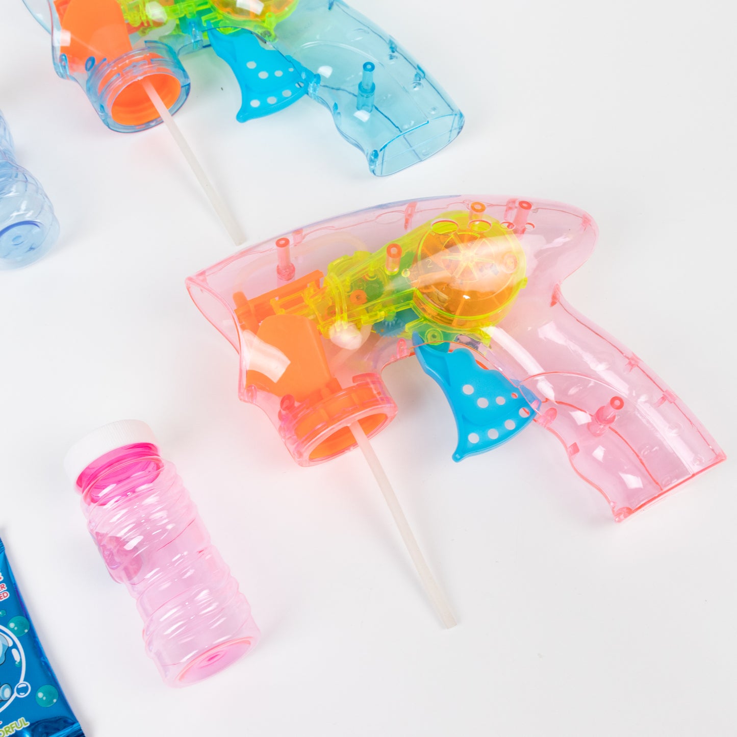 Pink LED bubble guns with refillable bottles for fun party favors.