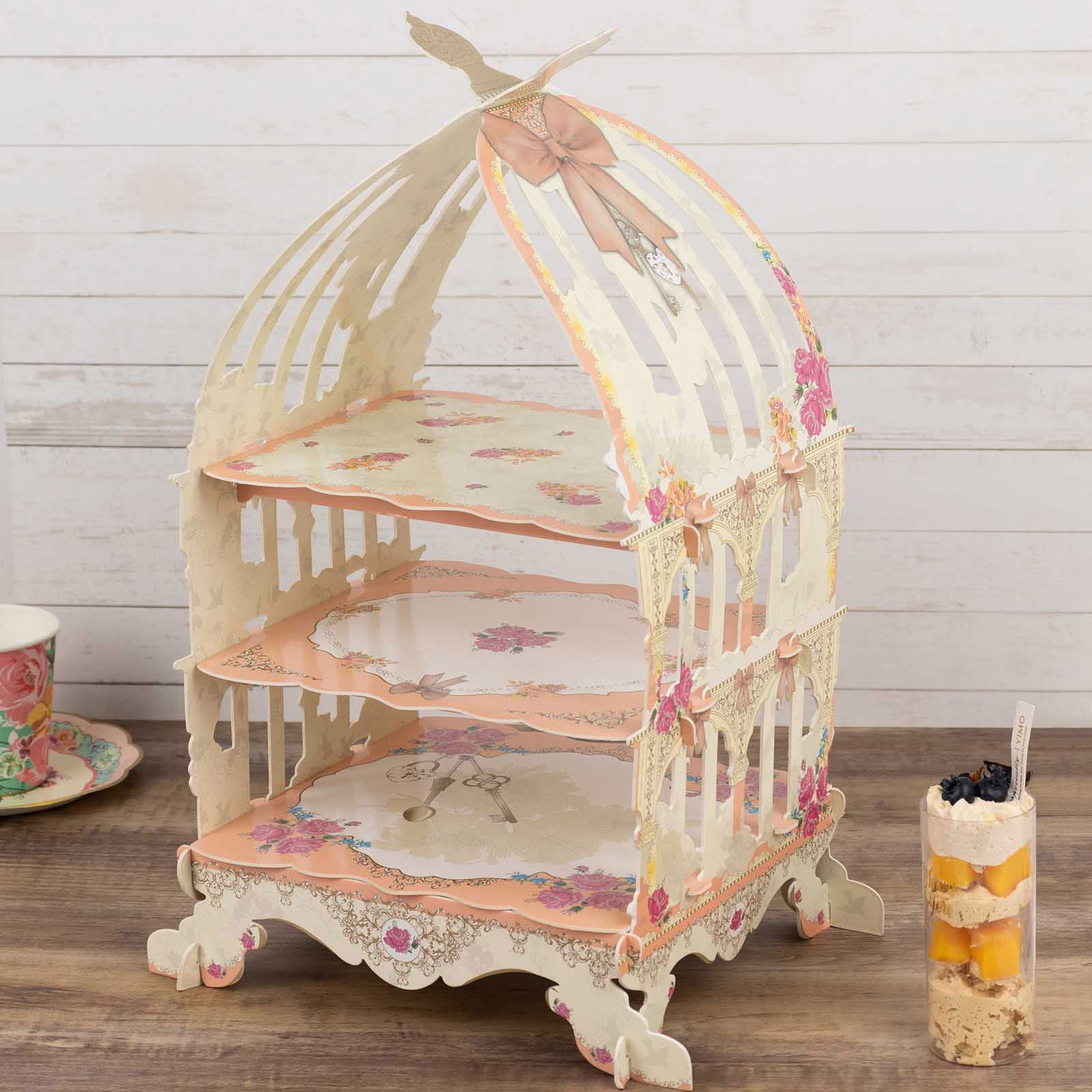 3 Tier floral print peach birdcage dessert stand with white accents.