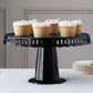 Black round pedestal cupcake stand with interchangeable ribbon trim, perfect for displays.