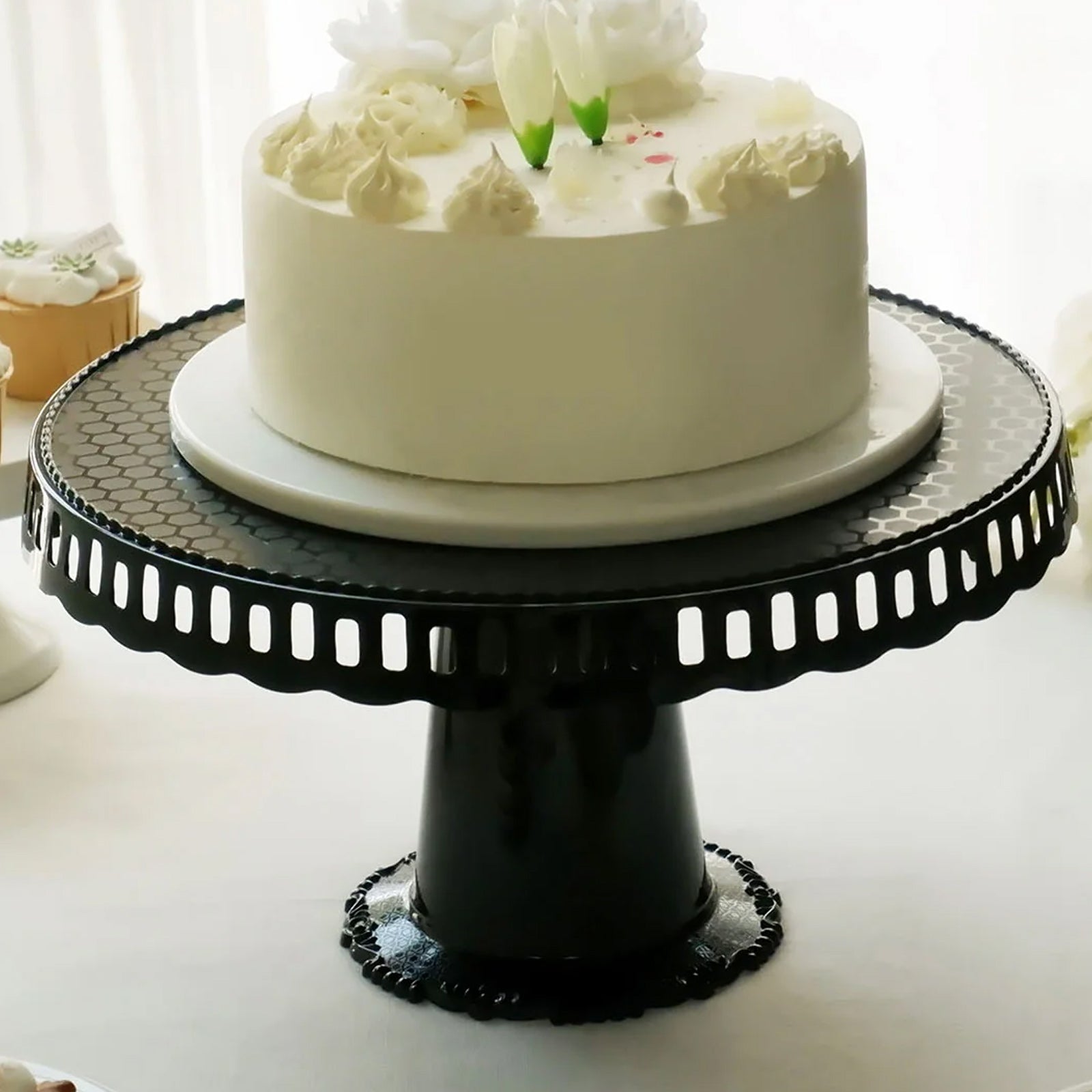 Black round pedestal cupcake stand with interchangeable ribbon trim.