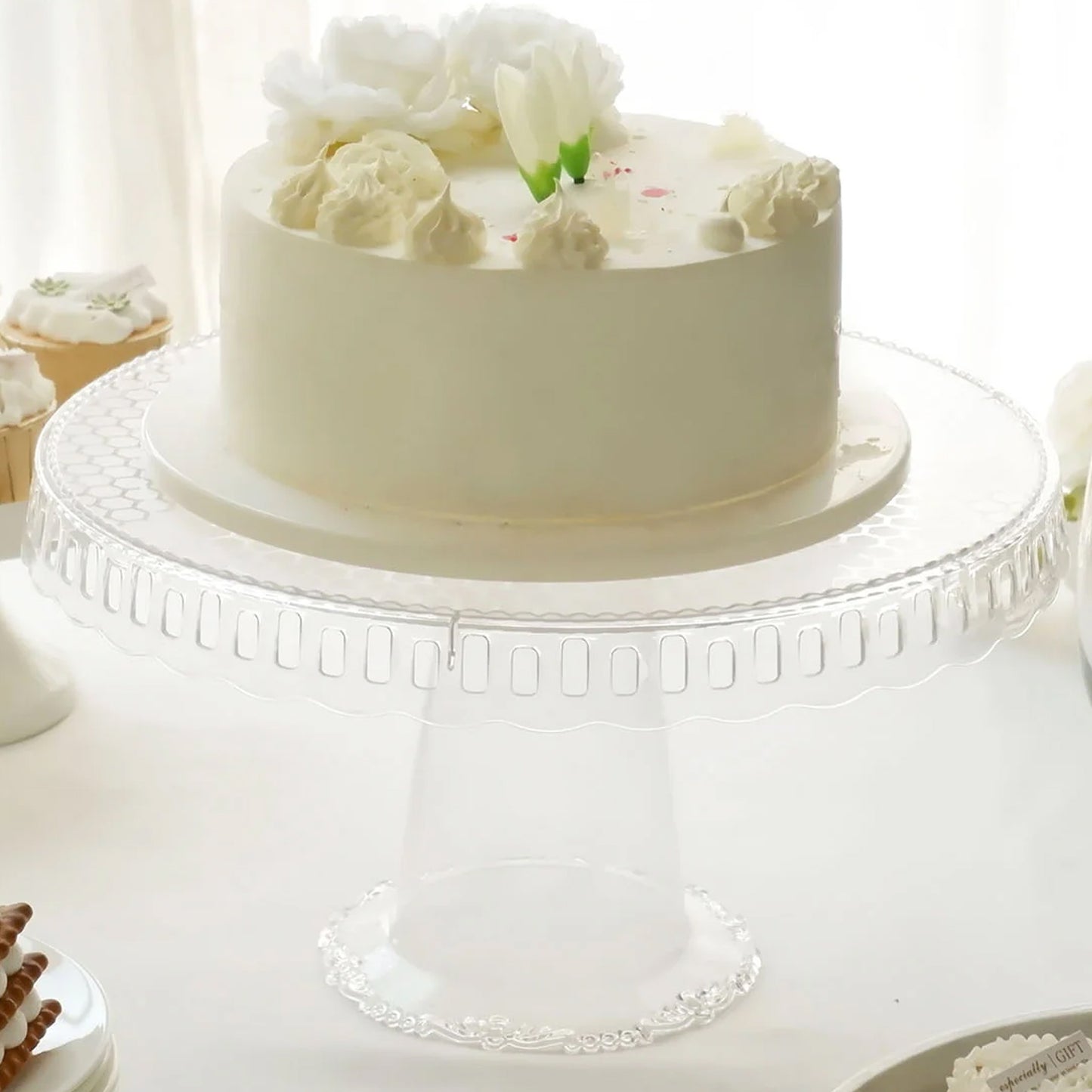Clear round pedestal cupcake stand with interchangeable ribbon trim edge.