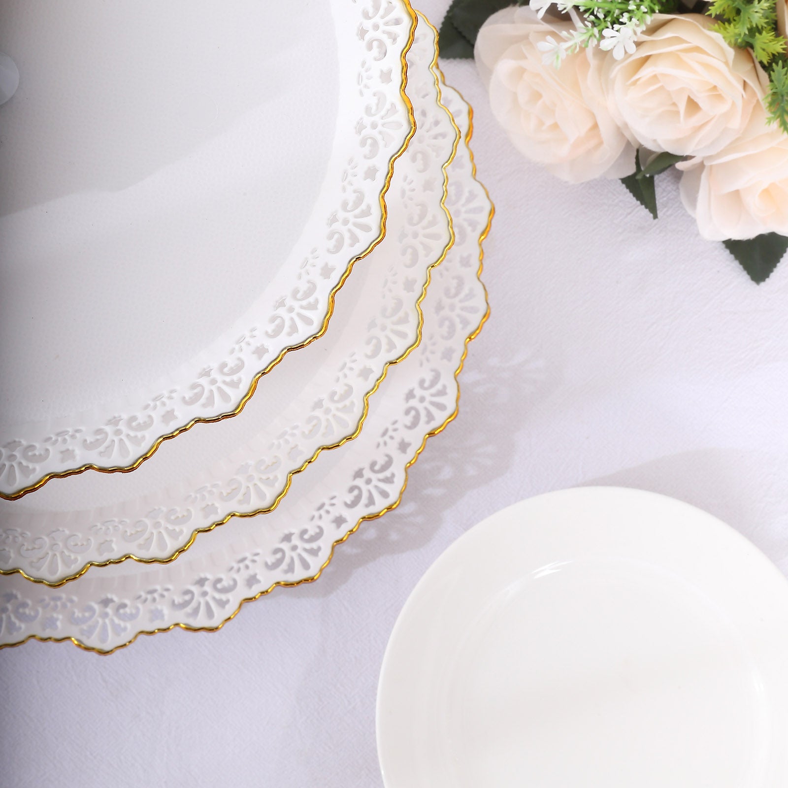 White 3-tier cupcake stand with lace cut gold rim and scalloped edges.