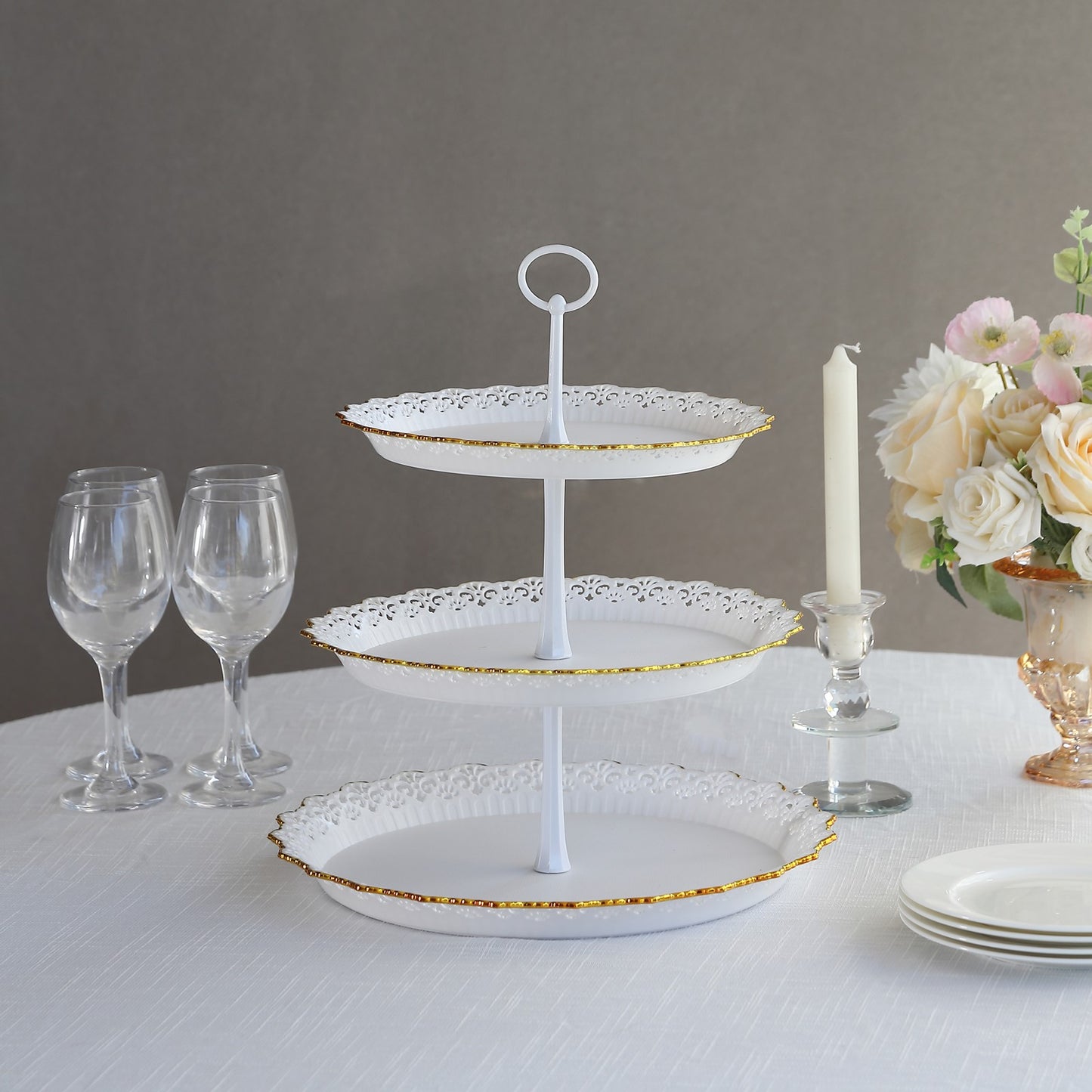 White 3-tier cupcake stand with lace cut gold rim and scalloped edges.