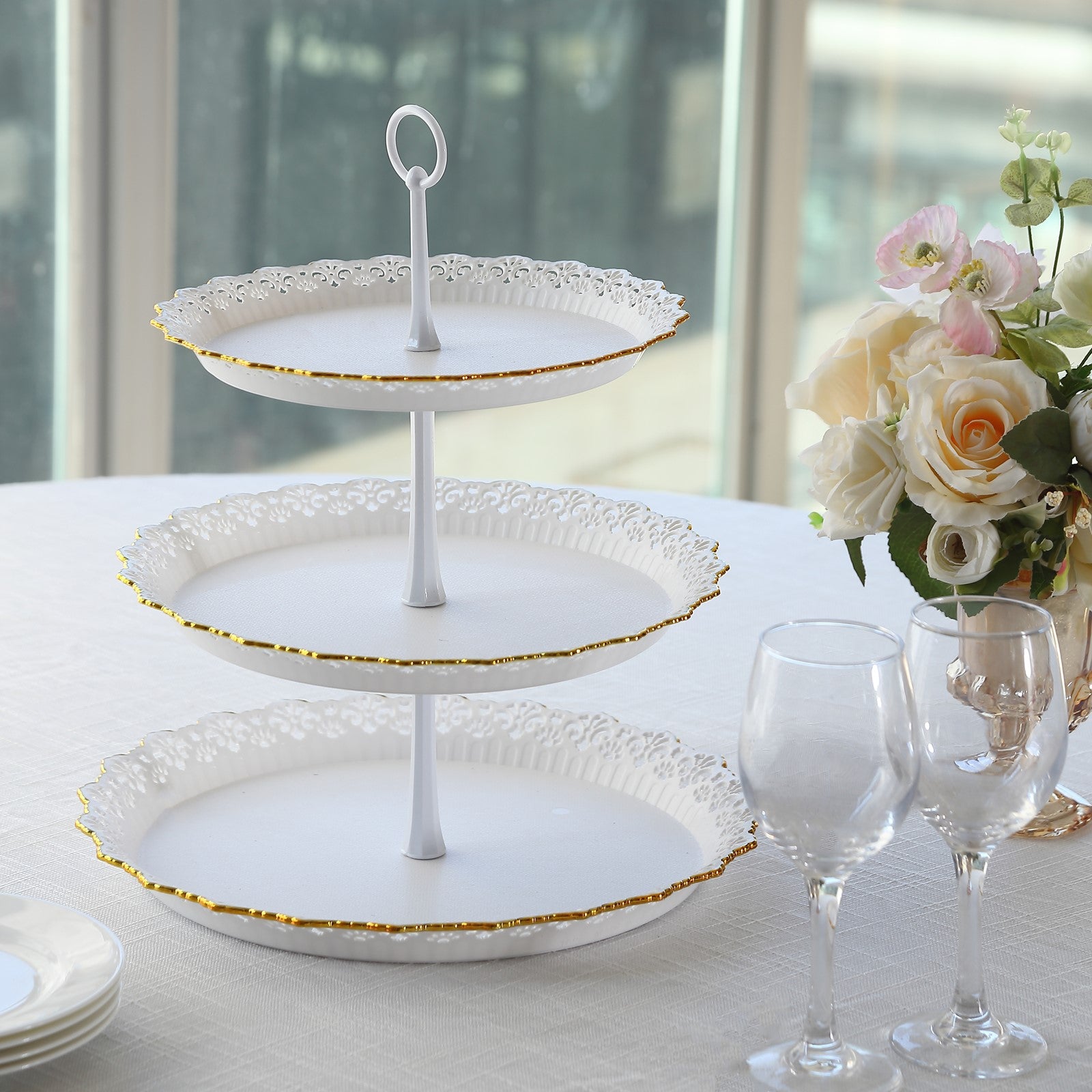 White 3-tier cupcake stand with gold rim and scalloped edges.