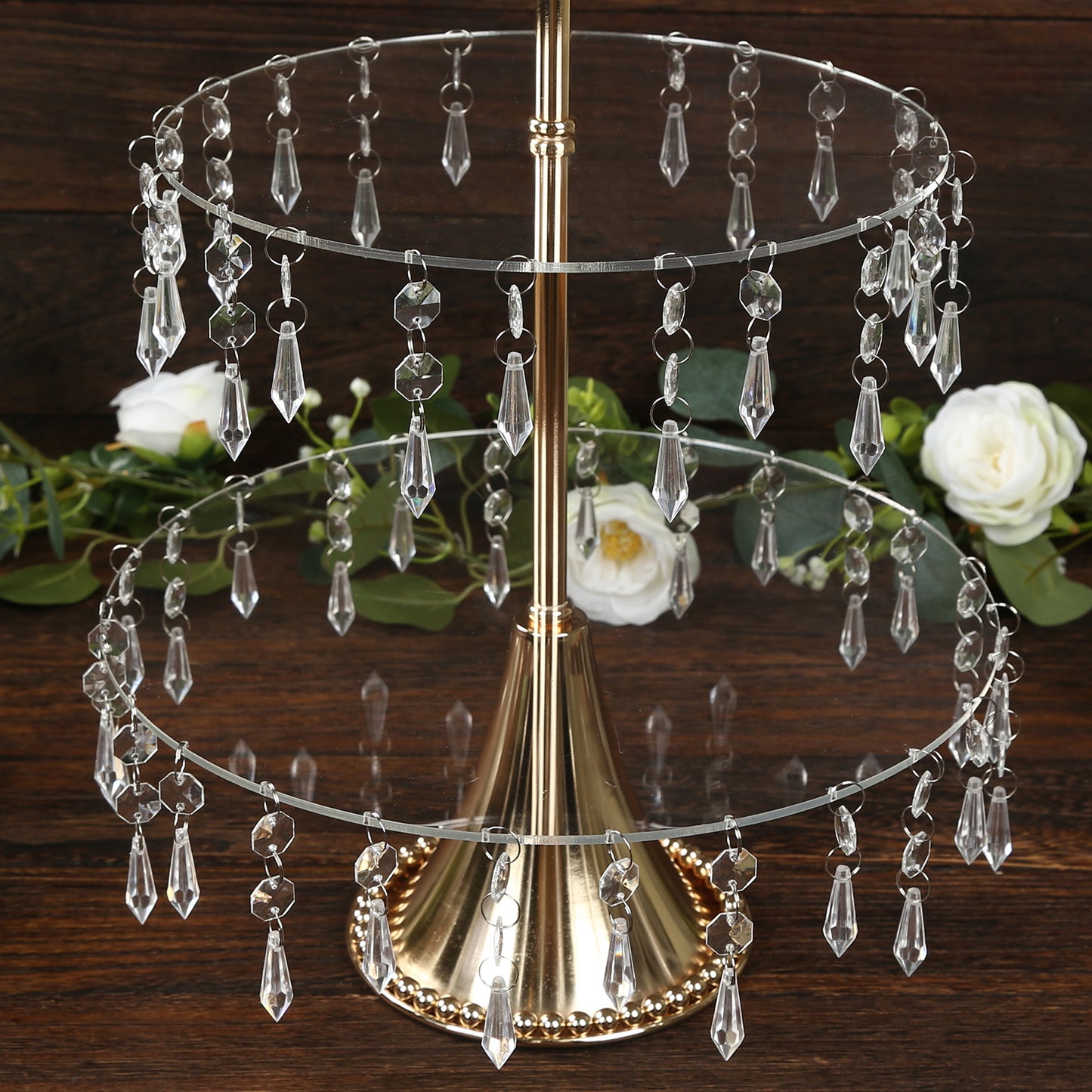 Gold 3-tier acrylic and metal cupcake stand with hanging crystals.