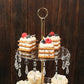 Gold 3-tier acrylic and metal cupcake stand with hanging crystals.