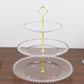 Clear 3-tier dessert display stand with beaded rim and gold handle.