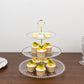 Clear 3-tier dessert display stand with cupcakes and beaded rim.