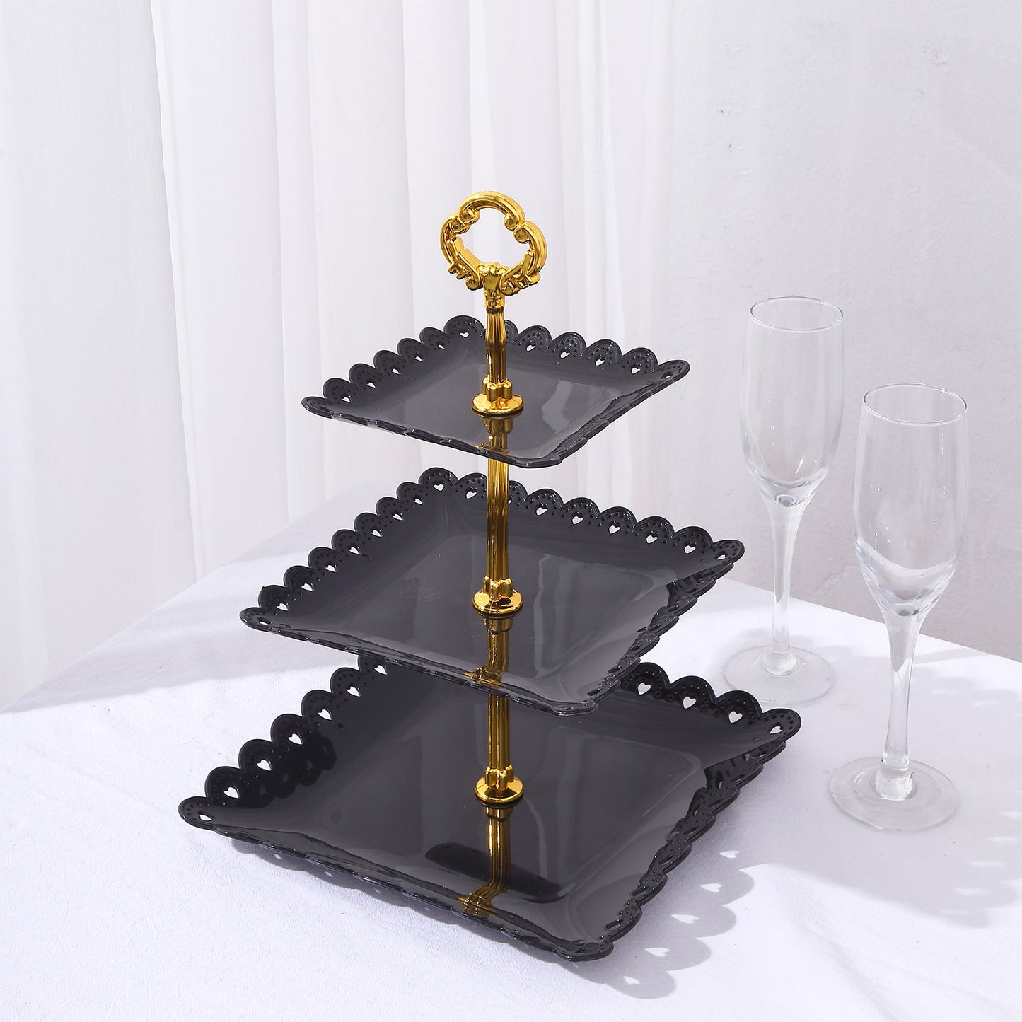 Black gold 3-tier cupcake stand with heart wavy edge and top handle.