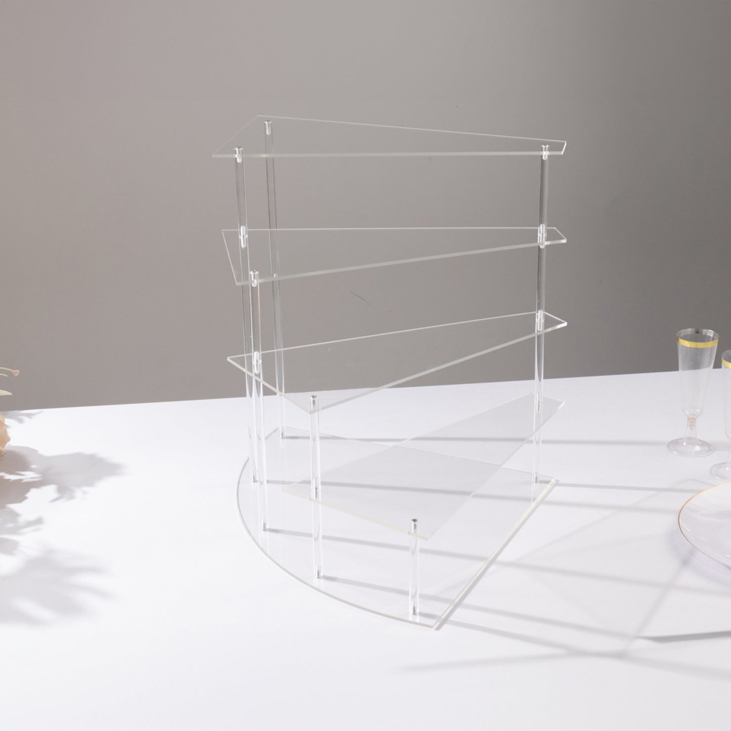 Clear acrylic 4-tier cupcake stand, perfect for desserts and perfume display.
