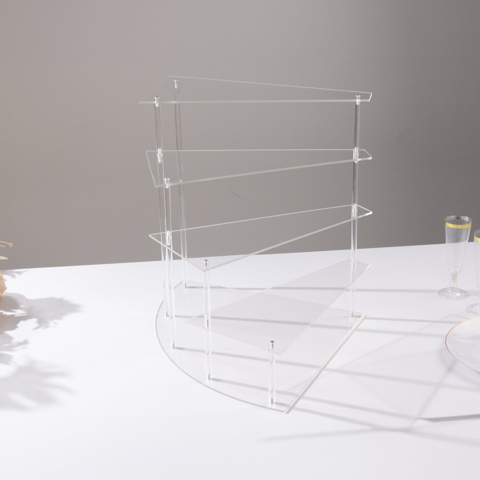 Clear acrylic 4-tier cupcake stand, perfect for desserts and perfume display.