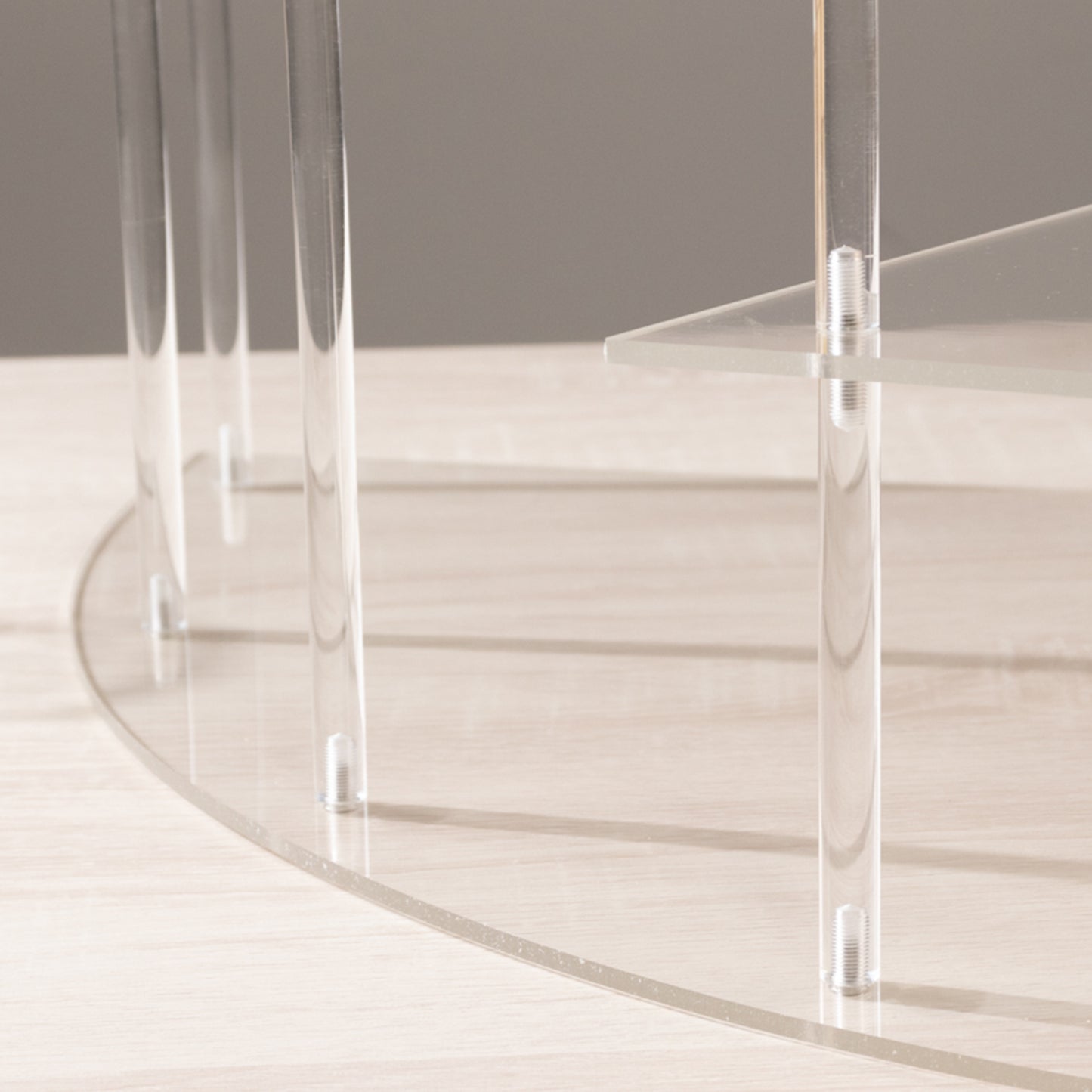 Clear acrylic cupcake stand with four tiers and elegant design.
