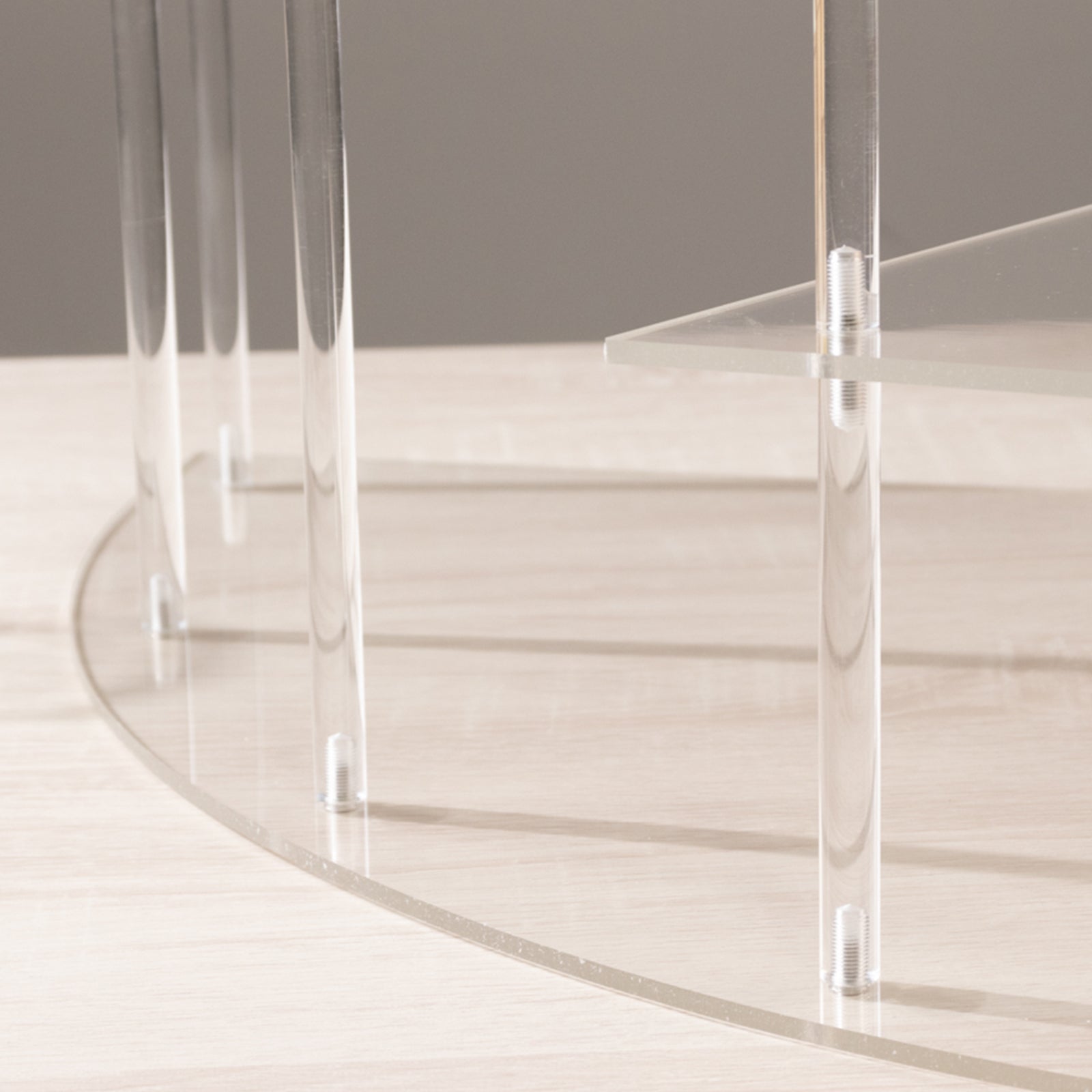 Clear acrylic cupcake stand with four tiers and elegant design.
