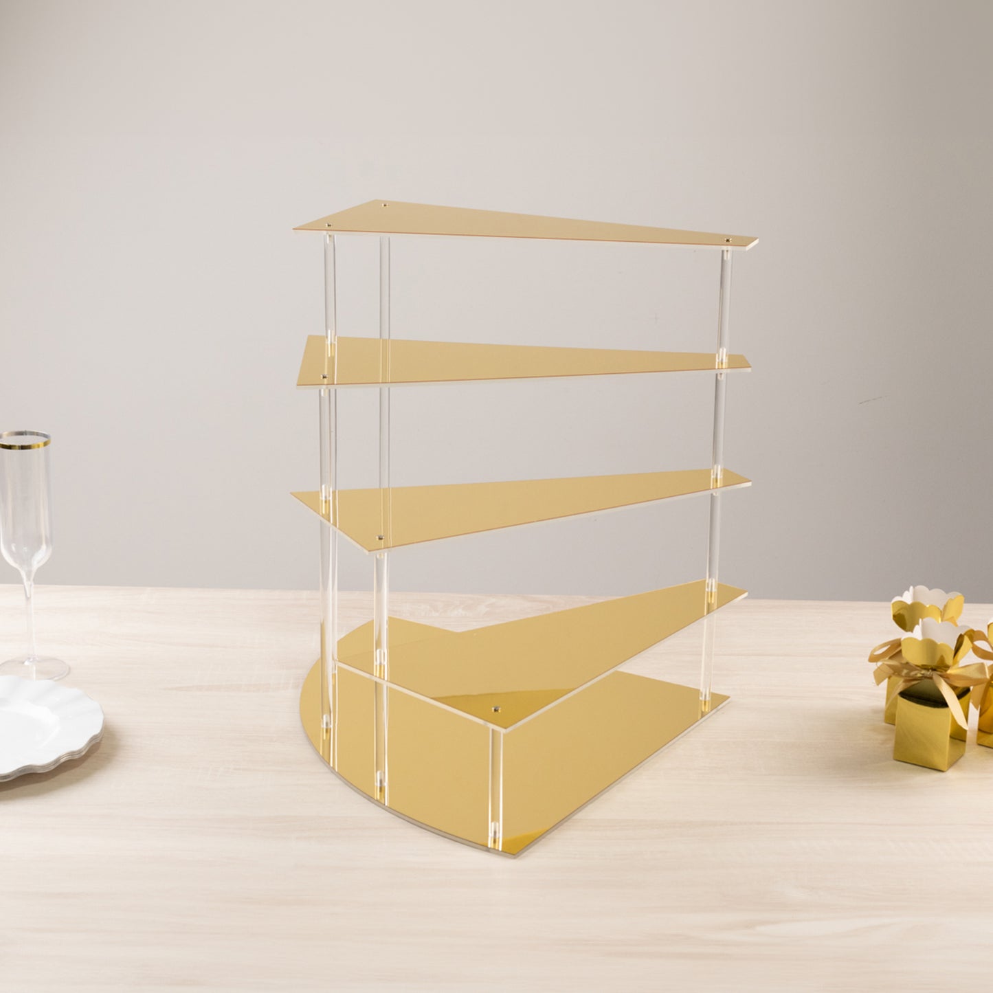 Gold spiral acrylic cupcake stand with mirror finish, 17" tall.