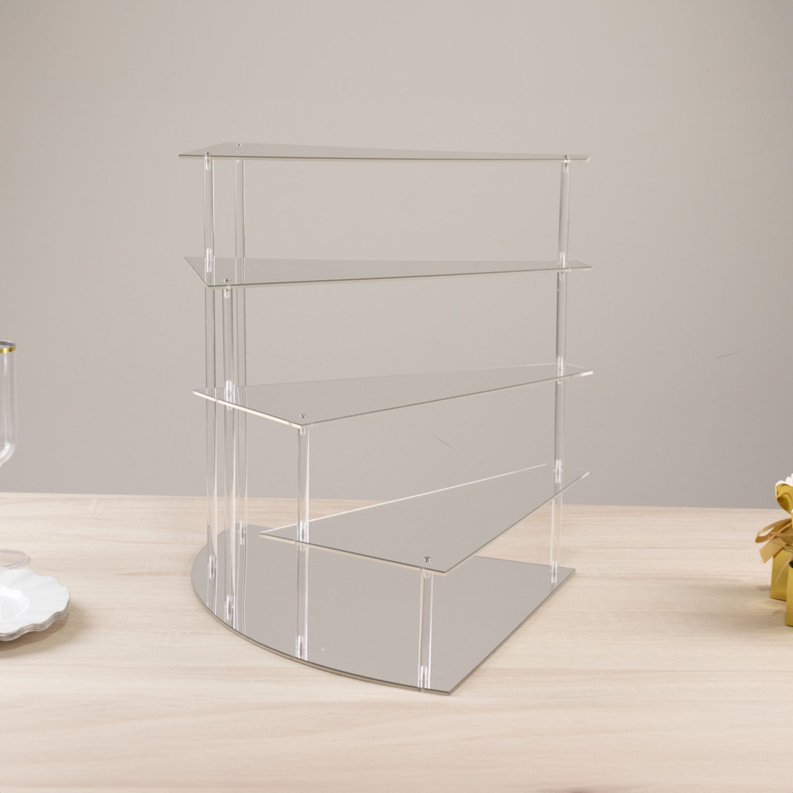 Silver spiral acrylic cupcake stand with mirror finish, 17" tall.