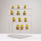 Silver acrylic cupcake stand displaying desserts.