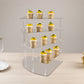 Silver 4-tier acrylic cupcake stand with a mirror finish, displaying desserts.