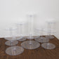 Clear acrylic 8-tier cake stand set on a wooden surface.