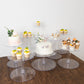 Clear acrylic cake stand set with desserts on display.