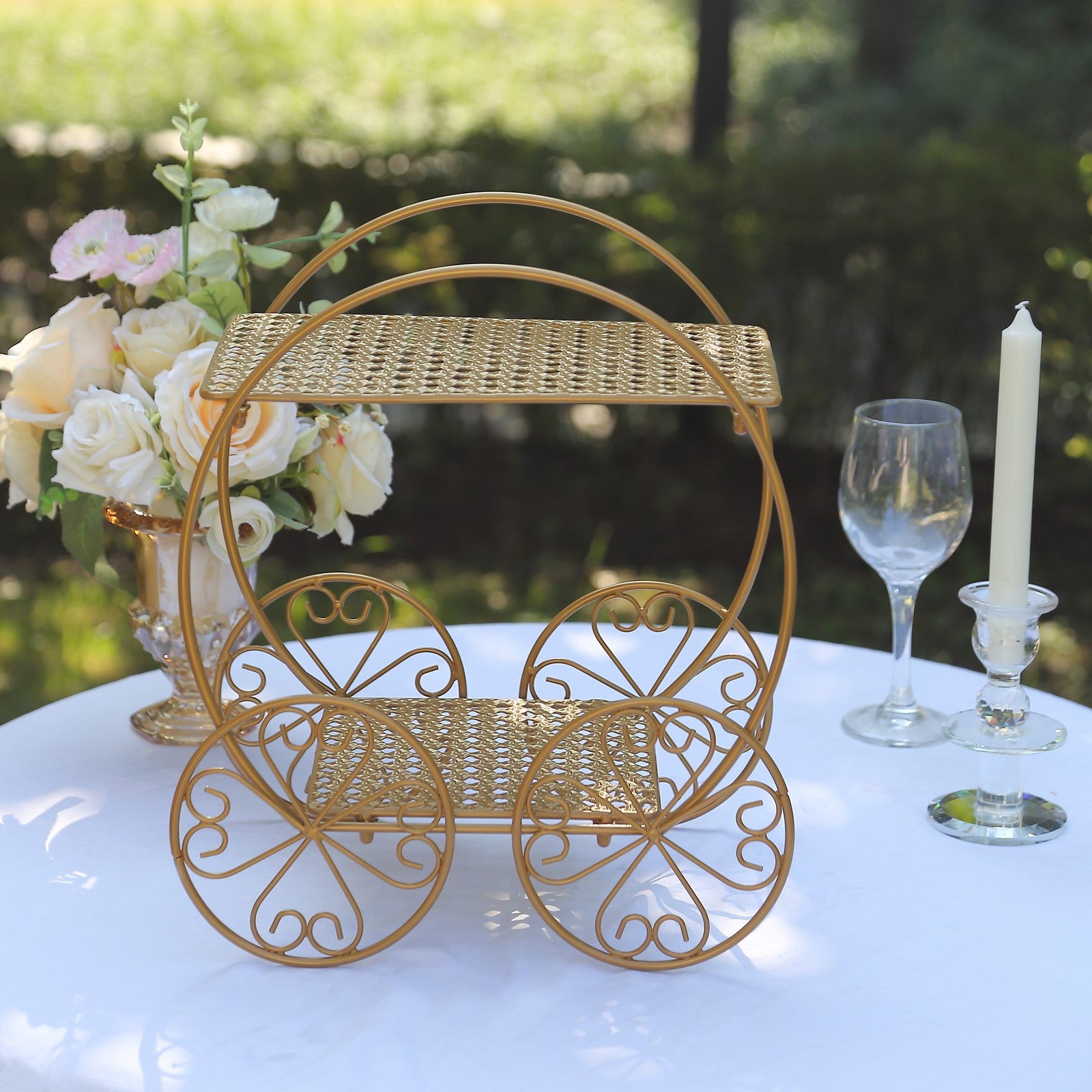 14" tall gold metal Cinderella carriage cake stand for weddings and events.