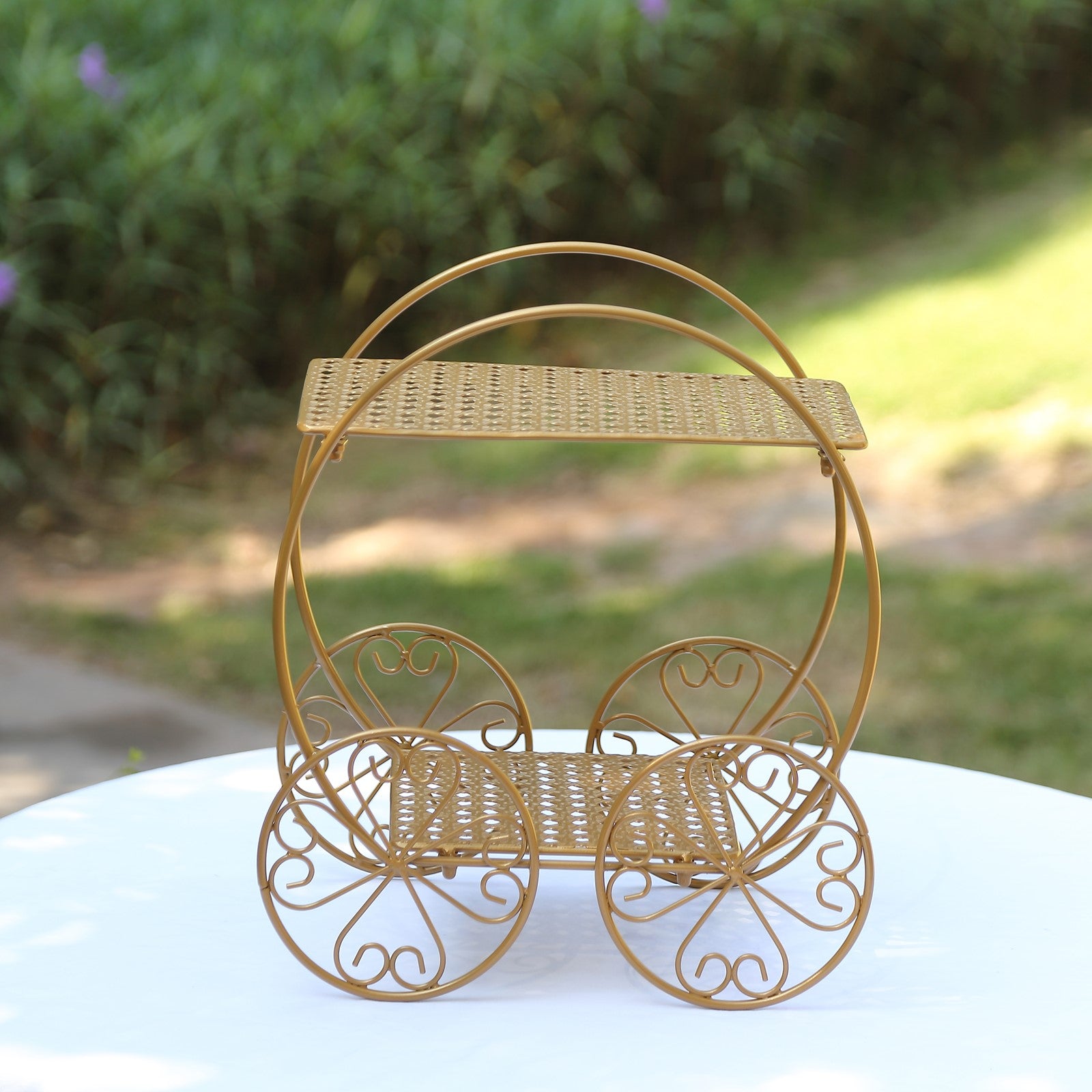 Gold metal Cinderella carriage cupcake stand for weddings and parties.