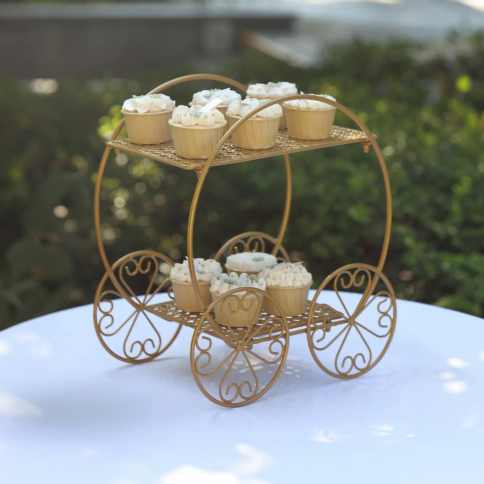 14" tall gold metal Cinderella carriage cupcake stand.