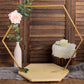 Gold hexagon metal floral hoop cake stand with wooden base and floral accents.