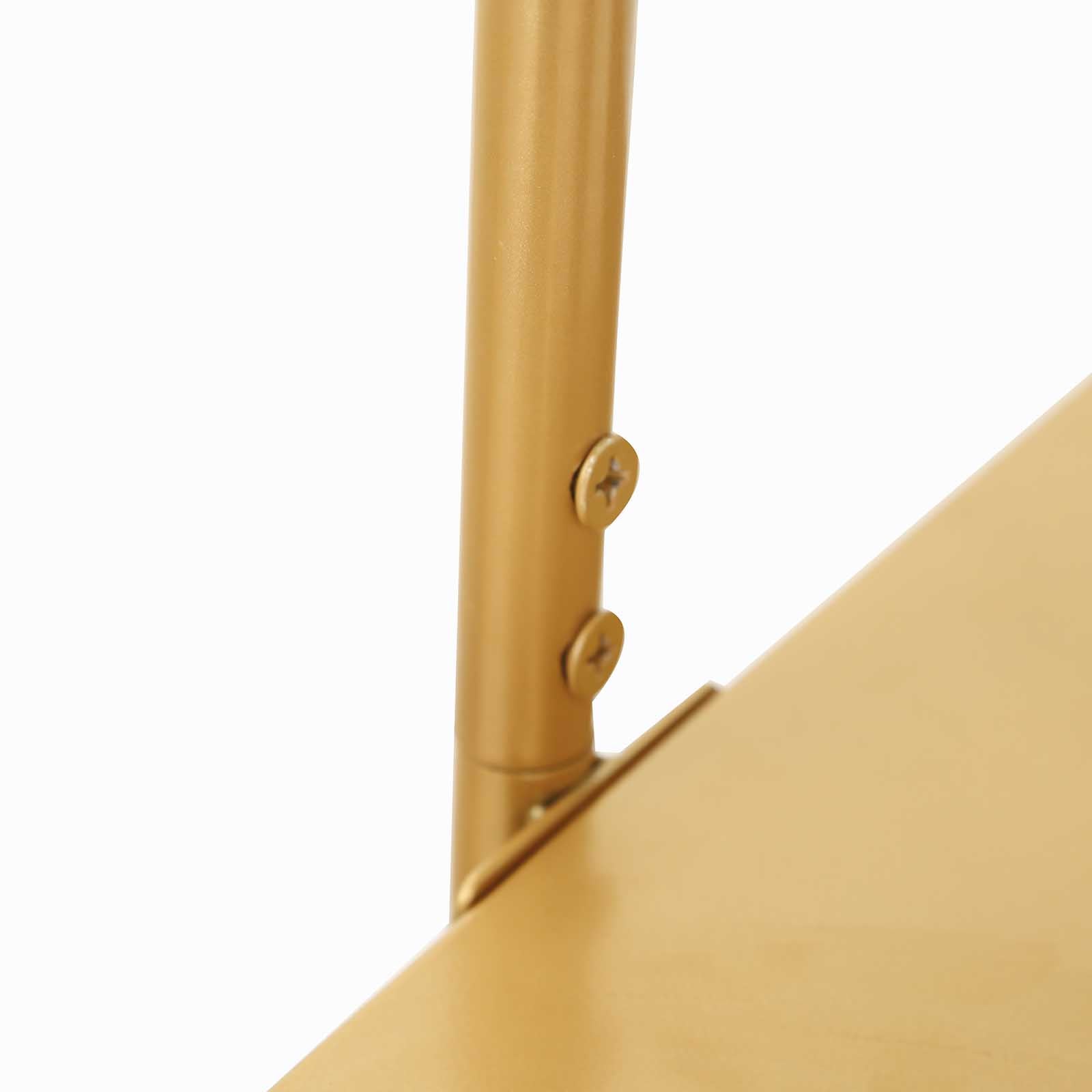 Gold metal arch cake display stand close-up detail.