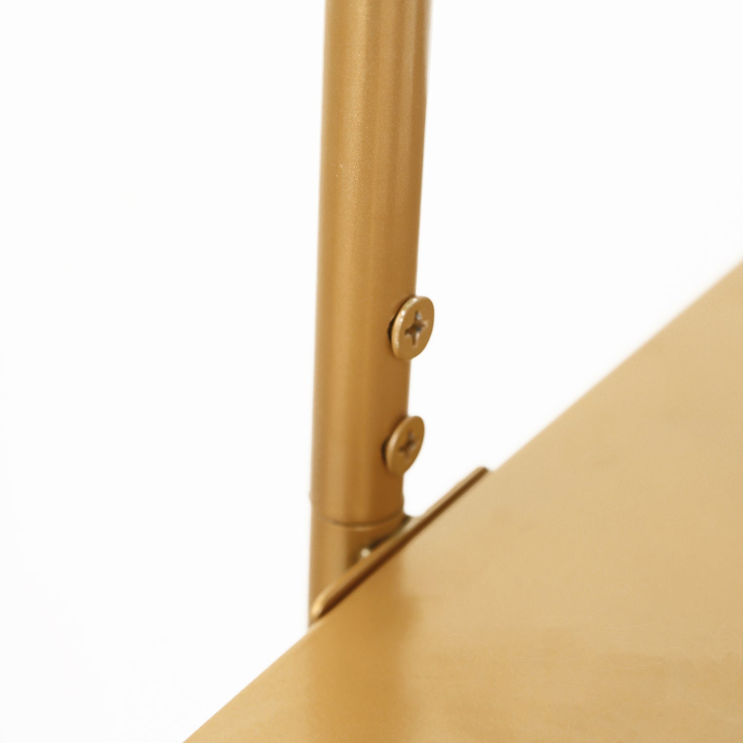Gold metal arch cake display stand detail close-up.