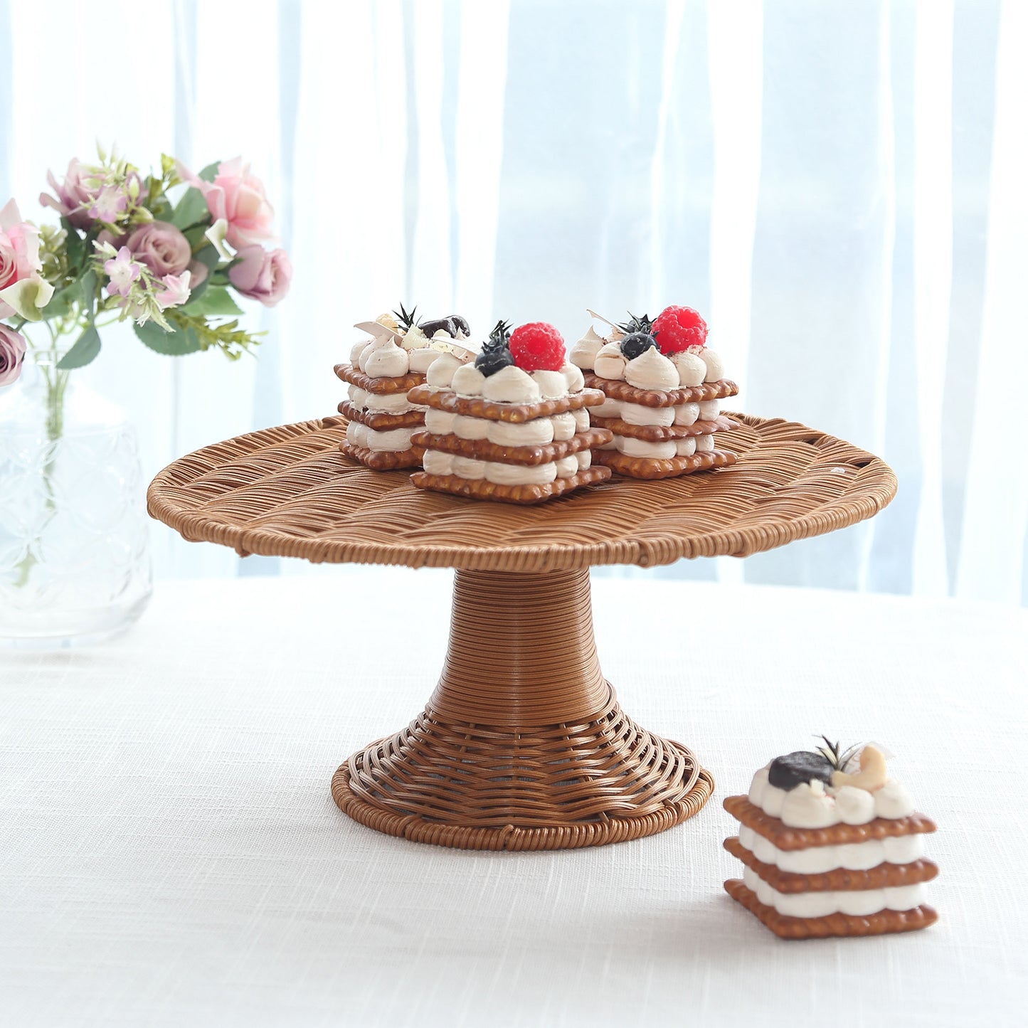Natural rattan wicker cupcake stand with rustic desserts on display.