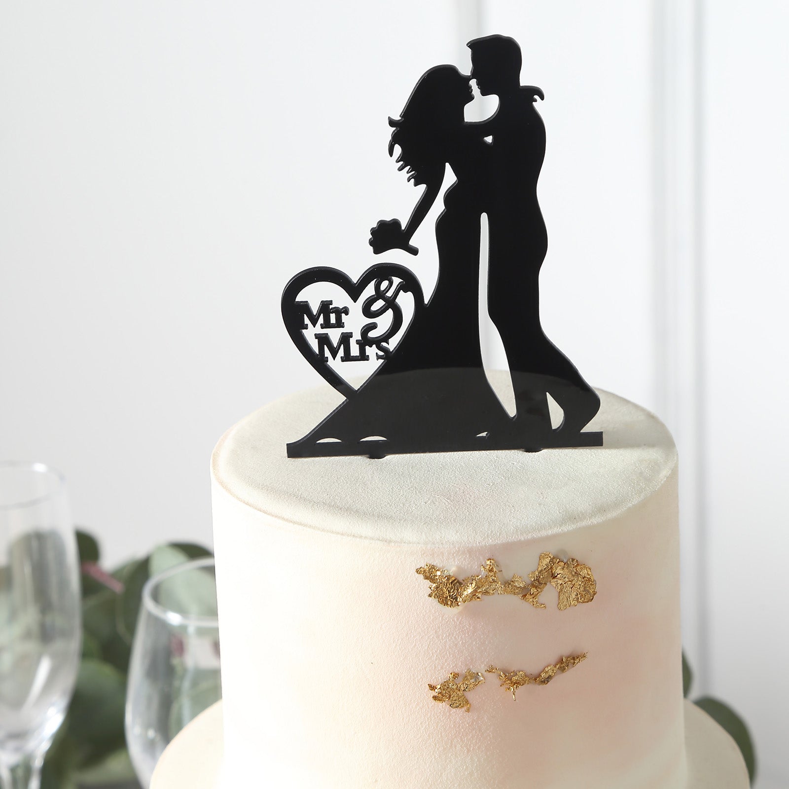 Black acrylic Mr and Mrs wedding cake topper for bride and groom decoration.